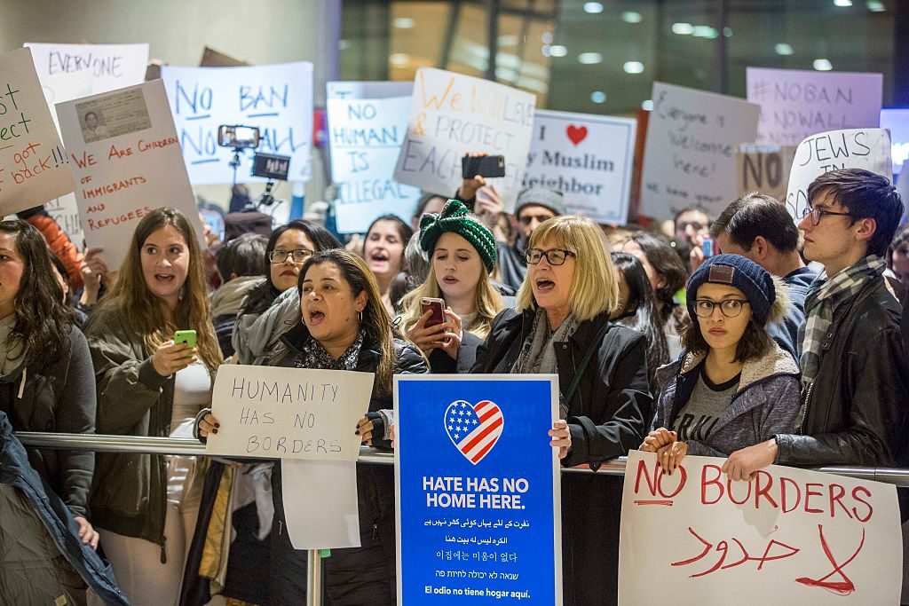 BOSTON, MA - JANUARY 28: Protestors rally at a demonstration against the new ban on immigration issued by President Donald Trump at Logan International Airport on January 28, 2017 in Boston, Massachusetts. President Trump signed an executive order that halted refugees and residents from predominantly Muslim countries from entering the United States. (Photo by Scott Eisen/Getty Images)