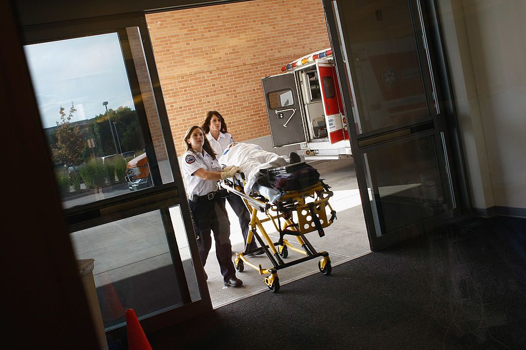 Paramedics bring an injured child into the emergency room of the non-profit Children's Hospital on September 14, 2009 in Aurora, Colorado. (Photo by John Moore/Getty Images)
