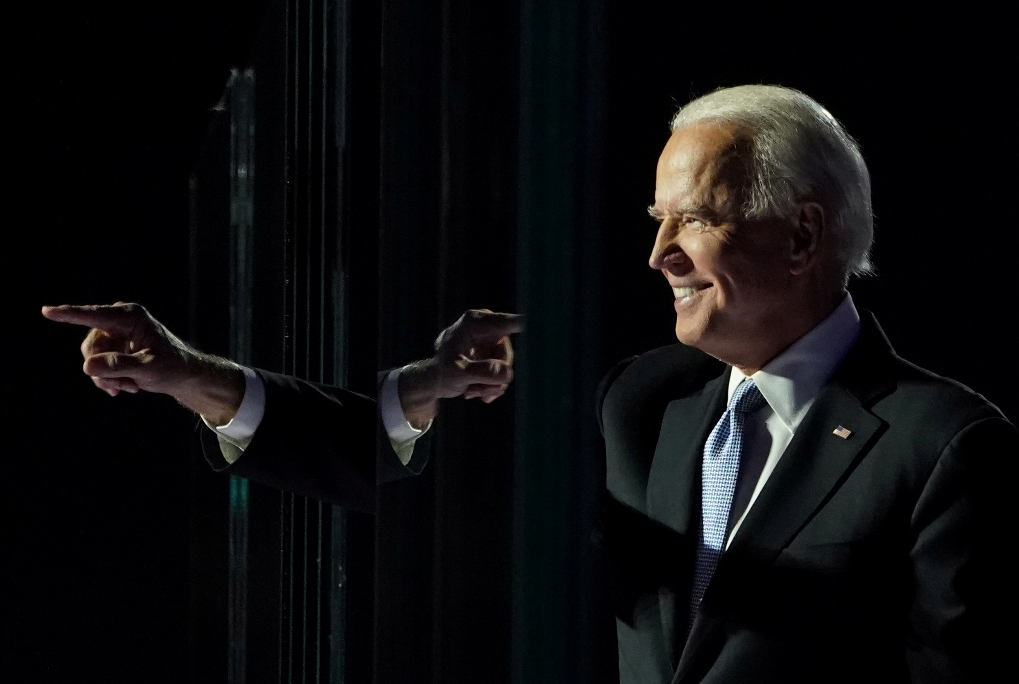 Democratic 2020 U.S. presidential nominee Joe Biden points a finger at his election rally, after news media announced that Biden has won the 2020 U.S. presidential election, in Wilmington, Delaware