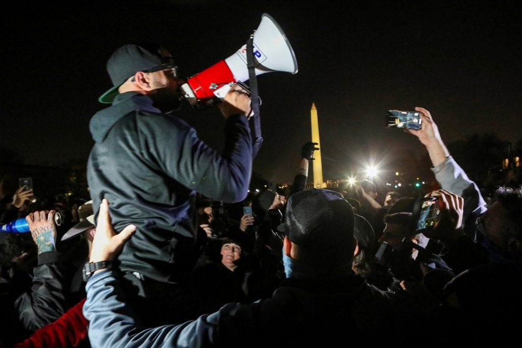 Proud Boys Chairman Enrique Tarrio addresses supporters of U.S. President Donald Trump and other members of the far-right Proud Boys during a march near the Washington Monument the night before rallies to protest the U.S. presidential election results, in Washington, D.C. (REUTERS/Jim Urquhart/File Photo)